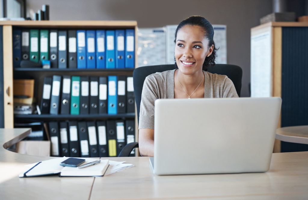 Shot of a businesswoman sitting behind her laptop in the office