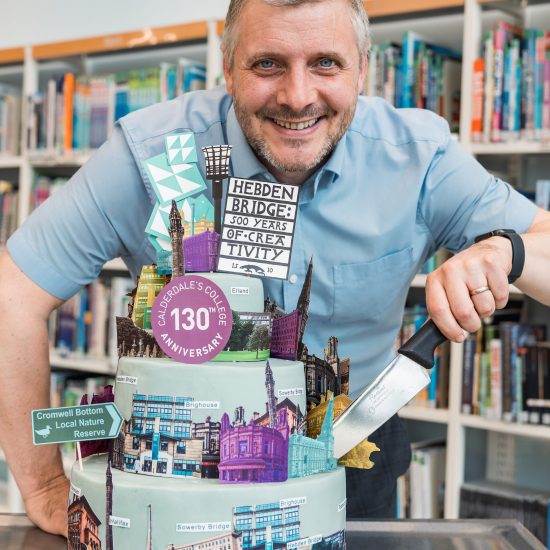 Principal David Malone cutting Calderdale College's 130th anniversary cake